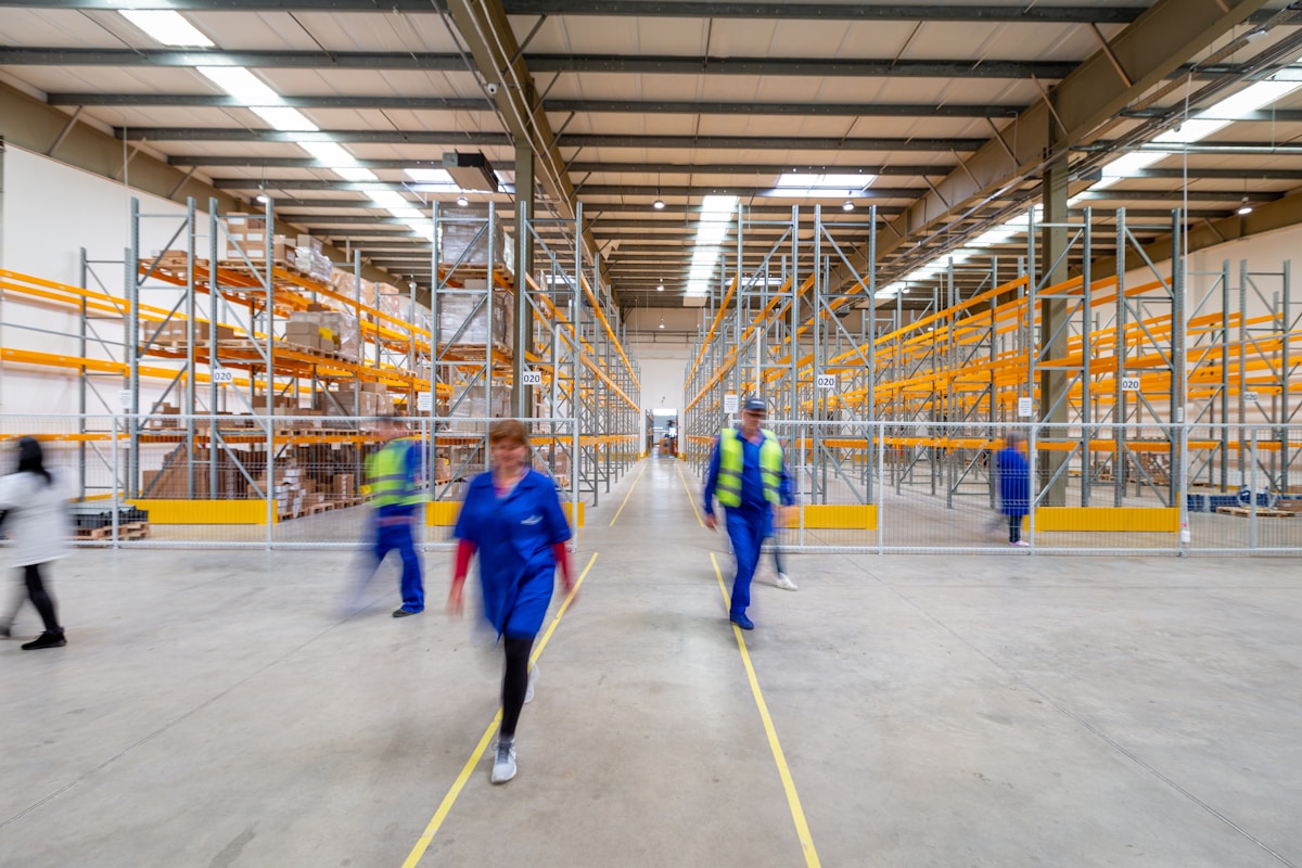 Warehouse worker using mobile terminal for inventory